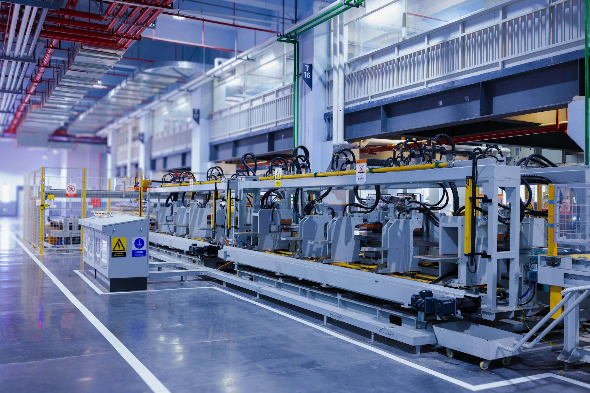 Wide view of an automated production line on a clean factory floor