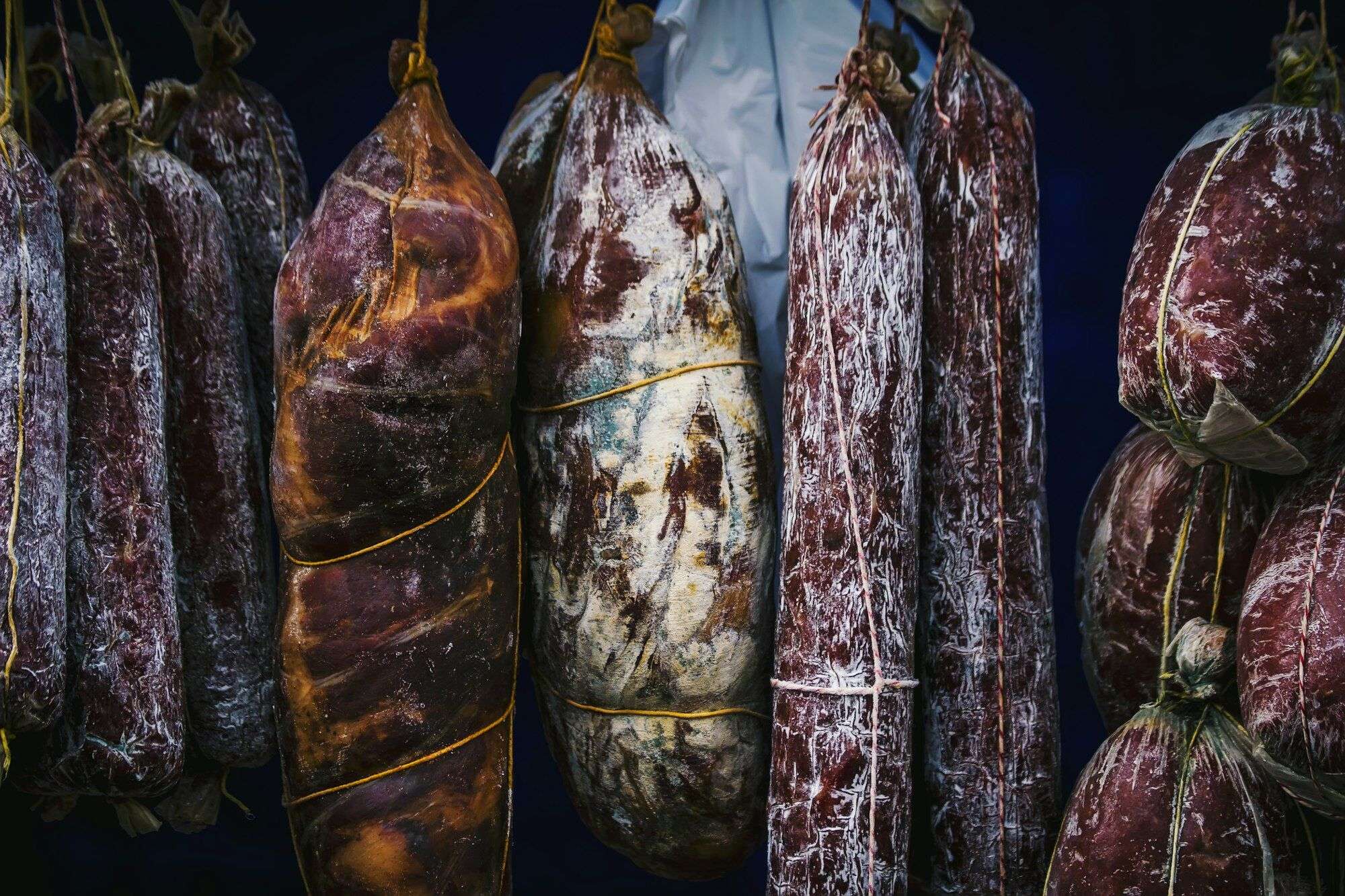 Cured and smoked sausages hanging to dry