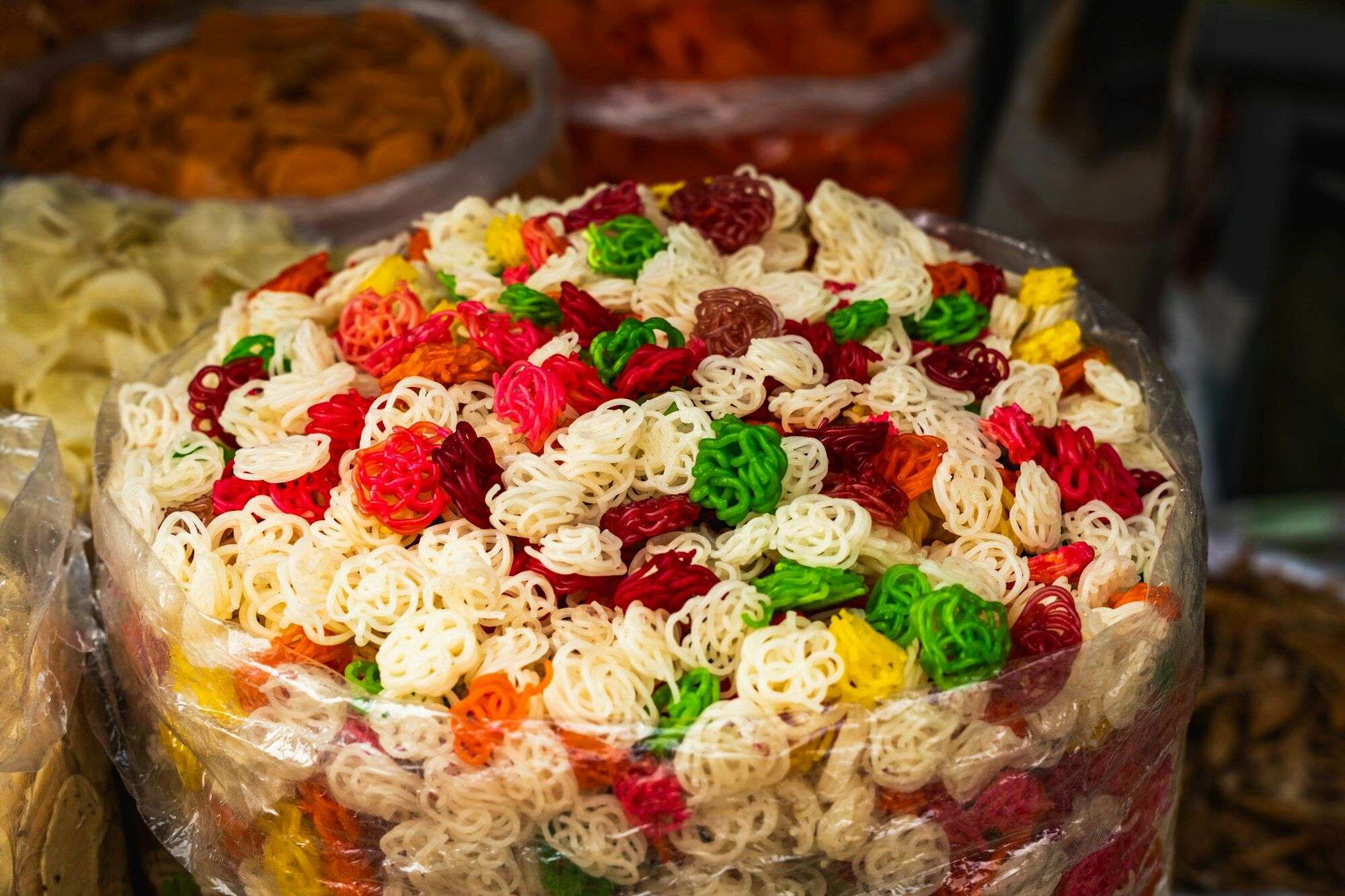 Bulk bag of coloured snack pellets ready for weighing and packing